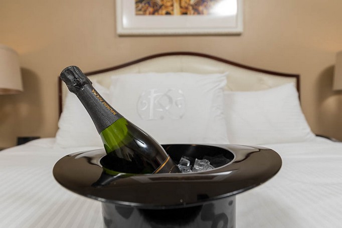 Champagne bottle in ice bucket in hotel room