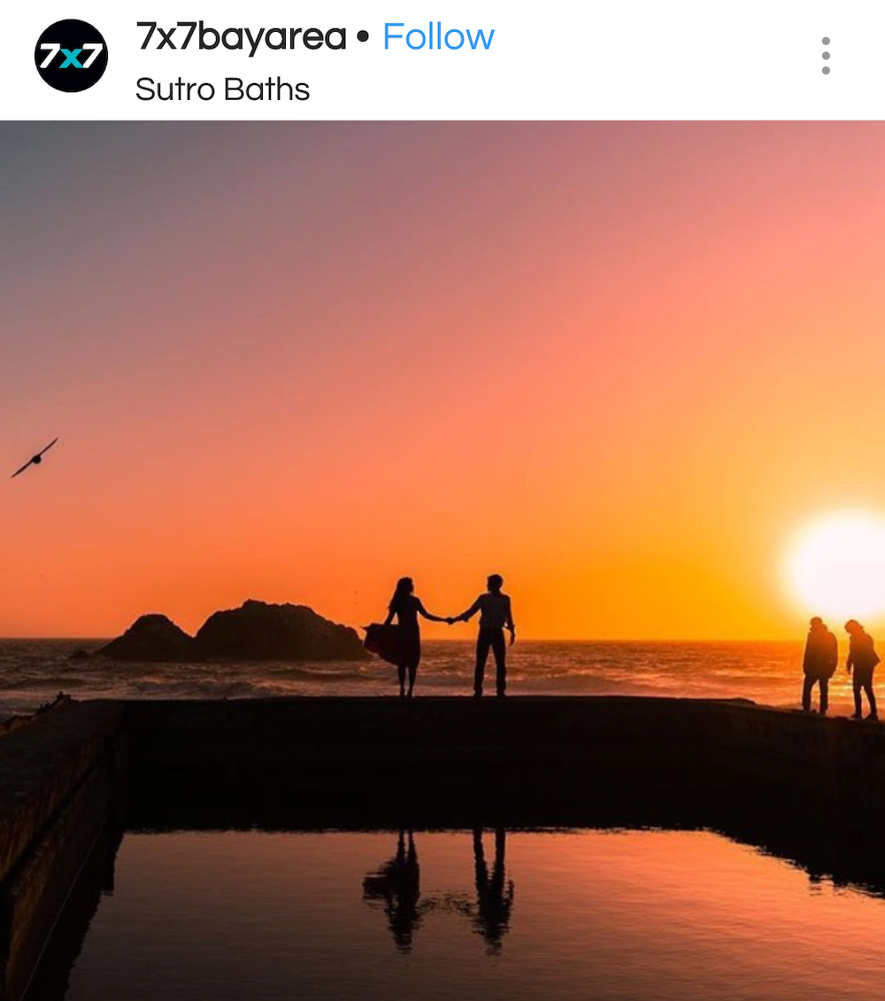 Couple standing at Sutro Baths ruins during sunset