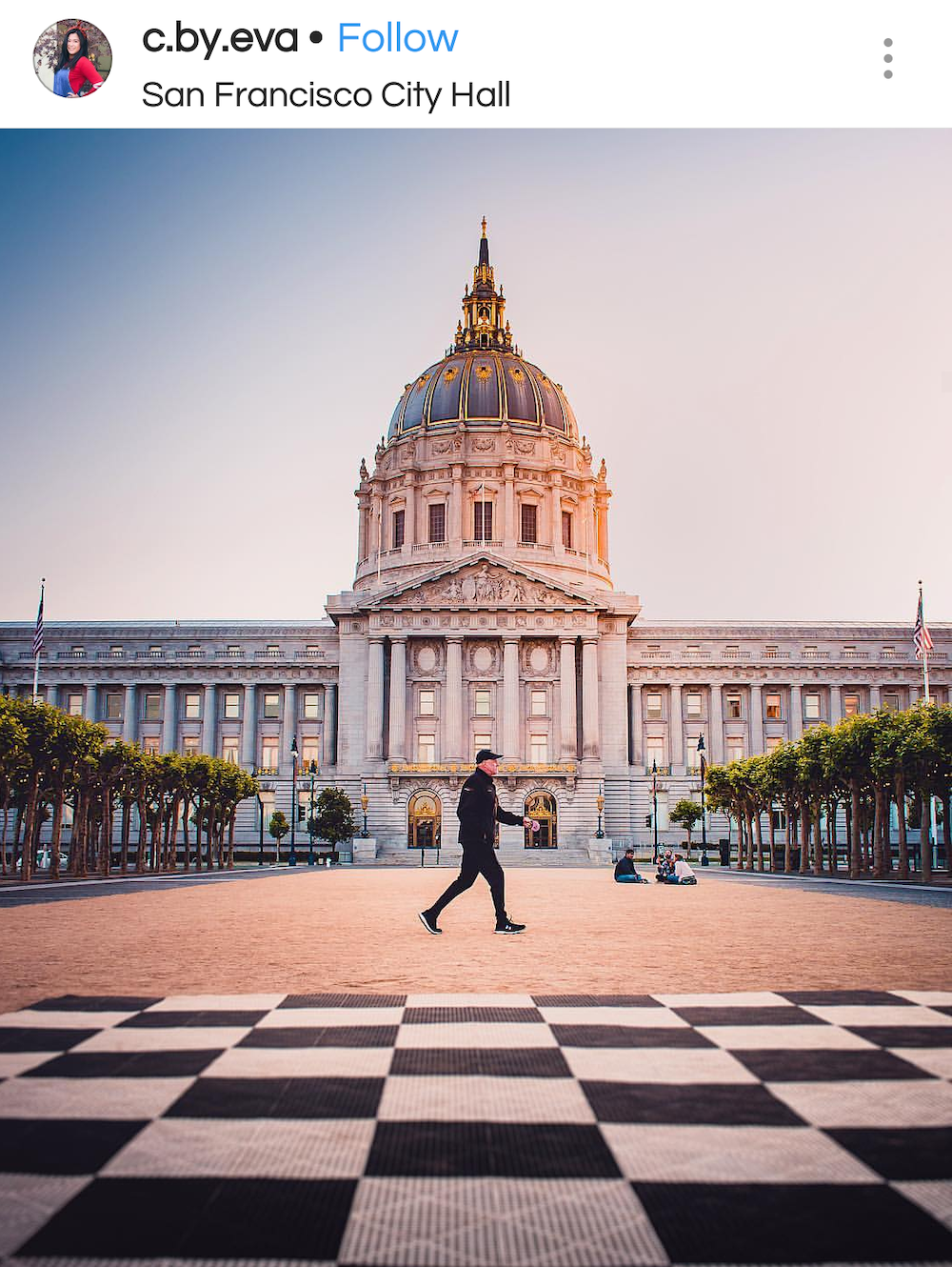 Security guard crosses in front of San Francisco's City Hall. 